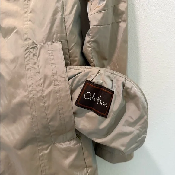 Cole Haan Chic Rain Coat with back bow & hideaway hood. Iridescent beige in XS. - Picture 6 of 13